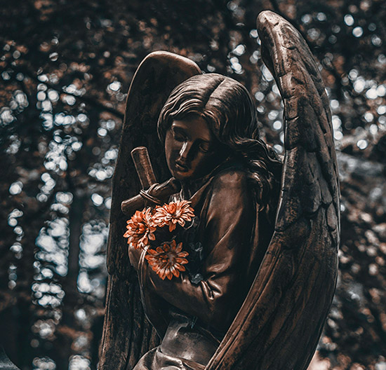 a statue of a woman holding flowers